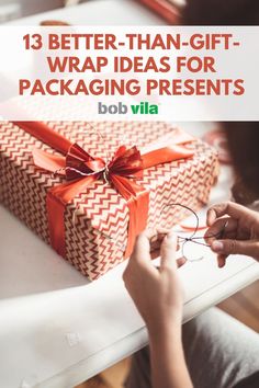 a person wrapping presents on a table with the words, 13 better - than - gift wrap ideas for packaging presents