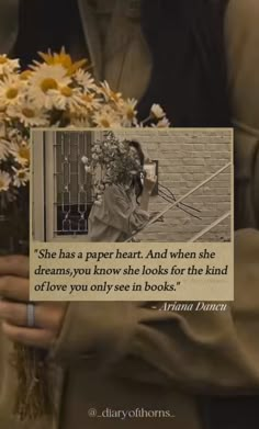 a woman holding flowers in her hands with a quote on it