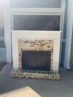 a fire place sitting in front of a window