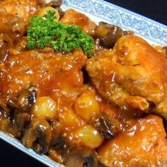 a close up of food on a plate with broccoli and sauce in it