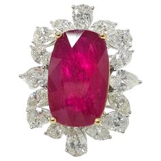 Elevate your jewelry collection with the luxurious allure of this IGI Certified 8.75 Carat ruby ring. This exquisite piece features a deep purplish red ruby, certified by the esteemed International Gemological Institute (IGI), showcasing unparalleled beauty and exceptional craftsmanship. The rectangular cushion mixed cut shape of the ruby adds a contemporary twist to the classic gemstone, enhancing its brilliance and enchanting color. The deep purplish red hue is truly mesmerizing, effortlessly Luxury Classic Style Lab-created Ruby Ring, Luxury Marquise Cut Ruby Ring With Halo Setting, Luxury Lab-created Ruby Diamond Ring, Luxury White Gold Ring With Lab-created Ruby, Luxury White Gold Rings With Lab-created Ruby, Luxury Polished Lab-created Ruby Ring, Ruby Jewelry Ring, Rectangular Cushion, Ruby Jewelry