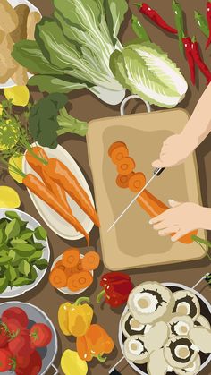 a person cutting carrots on a cutting board surrounded by vegetables and other food items