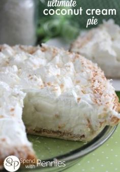 coconut cream pie on a green plate with a slice missing