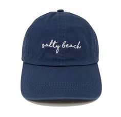 Catch some waves and stay shaded in our Embroidered Salty Beach Baseball Cap! Its adjustable buckle slide ensures it fits most, with 100% cotton to keep you comfy. Perfect for beach days, fishing trips, or summer hikes! Let's get salty! Cotton Beach Baseball Cap, Summer Beach Sun Hat With Curved Bill, Cotton Baseball Cap For Beach, Curved Bill Sun Hat For Summer Beach, Adjustable Cotton Hat For Beach Season, Trendy Cotton Dad Hat For Vacation, Trendy Cotton Hat For Vacation, Vacation Hats With Curved Bill In Cotton, Summer Adjustable Baseball Cap With Embroidered Logo