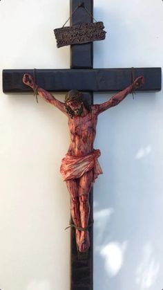 the crucifix is painted red and black