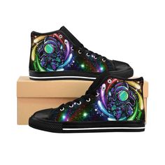 "In these Womens Trippy Rainbow Colored Astronaut Shoes, Fashion sense has no limits so Reach for the Stars and spread cosmic vibes around the galaxy! With the black base and bright colorful design these shoes will pop and stand out in a crowd and sure to get noticed. A perfect gift idea for any fan of space travel, science fiction and all things intergalactic. These classic canvas sneakers with a modern rave festival style design are super comfy and soft and feel amazing to walk in. Get yoursel Space Rainbow, Trippy Rainbow, Festival Style, Pride Rainbow, Mens High Tops, Rave Festival, Trendy Sneakers, Space Travel, Rainbow Pride