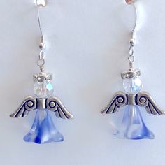 Beautiful Crystal White And Blue Angel Earrings With Rhinestone Halo. Stainless Steel Ear Wires. One And A Half Inches Long. Handcrafted. Angel Beaded Earrings, Diy Angel Earrings, Christmas Bazar, Lampwork Bead Earrings, Sterling Silver Turquoise Earrings, Pink Tassel Earrings, Teardrop Jewelry, Silver Turquoise Earrings, Diy Jewelry Display