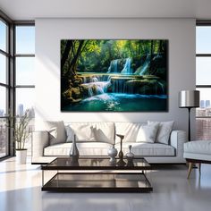 a living room with a couch, coffee table and painting on the wall above it