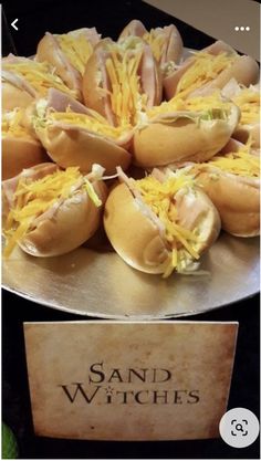 there are many hot dogs with cheese on them