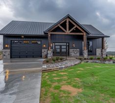 a large house with two garages in the front yard