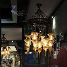 a chandelier hanging from the ceiling in a restaurant