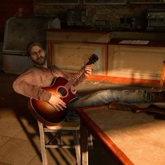 a man sitting at a table with a guitar