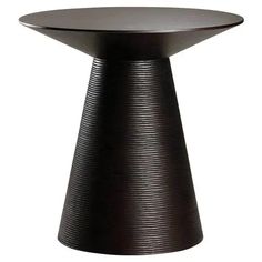 a black table with an unusual design on the top and bottom, sitting in front of a white background