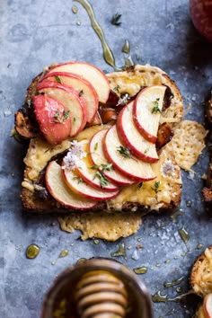 apple slices and crackers on top of bread