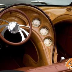 the interior of an old car with wood grain and gauges on it's dashboard