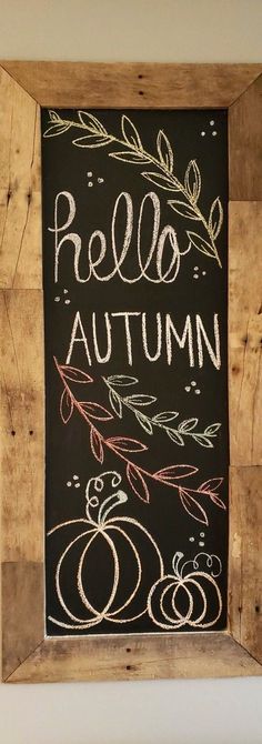 a chalkboard with the words rello autumn written on it and an apple below