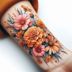 a woman's arm with flowers on it