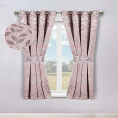 a window with pink curtains in front of it