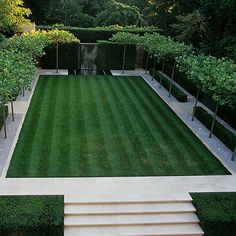 an aerial view of a garden with steps leading up to the lawn