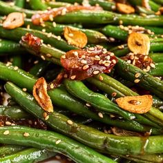 green beans with nuts and sesame seeds on top