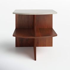 a wooden shelf with a white marble top on it's sides and two legs