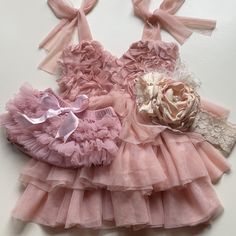 Dusty Ballet Pink Tulle Dress With V Neck, Ruffled Tiers, Bodice, And Adjustable Shoulder Ties. Fully Lined In Soft Jersey. Some Minor Pulls On The Tulle But Nothing Major. Custom Made, Ordered Off Etsy For My Daughter’s First Birthday/Photos. Paid $175+. No Size Tag But Could Easily Fit Beyond 12months. Dust Pink Ruffle Bum Bloomers With Satin Bow. Minor Pulls/Pilling. No Size But Fits 12-18 Months+ Gorgeous Custom Made Headband Fit 12months+. The Details On This Are Second To None. Dress With V Neck, Dust Pink, Pink Tulle Dress, How To Make Headbands, First Birthday Photos, Ballet Pink, Pink Tulle, Pink Ruffle, Satin Bow