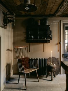 an old fashioned chair sitting in front of a radiator