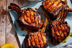 grilled steaks on a plate with mustard