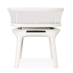 a white plastic planter sitting on top of a table