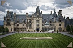 a large building with a massive lawn in front of it