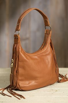 Fashioned of the finest European aniline cowhide leather, our classic hobo style shoulder bag covers all the bases. Made in the USA. Hobo Style, Bag Cover, Taos, Leather Fringe, Quilted Bag, Contrast Stitch, Soft Suede, Shoulder Handbags, Rebecca Minkoff Hobo