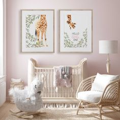 a baby's room with two giraffes on the wall and a rocking chair