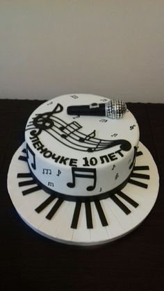 a cake decorated with musical notes and piano keys