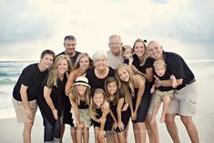 a family poses for a photo on the beach