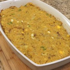 a casserole dish is sitting on a cutting board