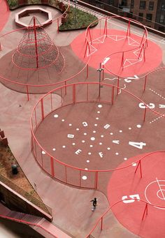 an aerial view of a playground with swings and obstacles