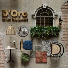 an outdoor restaurant with chairs, tables and plants on the outside wall that says doro italian restaurant