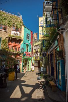 an alleyway with many colorful buildings on both sides