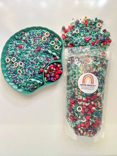 two bags of beads next to each other on a white table with a green tray