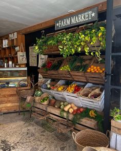 an open market with fruits and vegetables on display in baskets, hanging from the ceiling