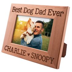 a wooden frame with the words best dog dad ever and a photo of a man holding his dog