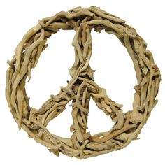 a peace sign made out of drift wood