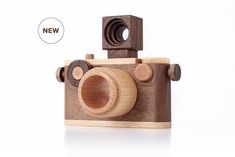 a wooden toy camera sitting on top of a table