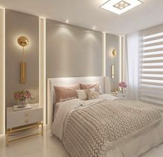 a white bed sitting in a bedroom next to a wall mounted light above it's headboard