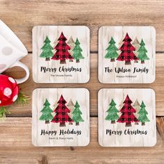 four coasters with christmas trees on them and the words merry holidays printed on them