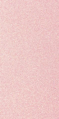 an abstract pink background with small speckles