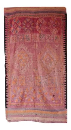 an old pink and orange rug on a white background