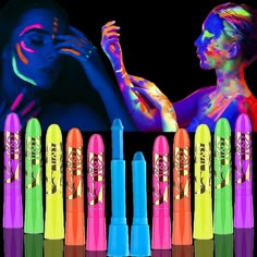 an assortment of neon colored lip glosses in front of a woman's face