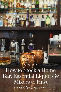 a bar with liquor glasses and bottles on the counter