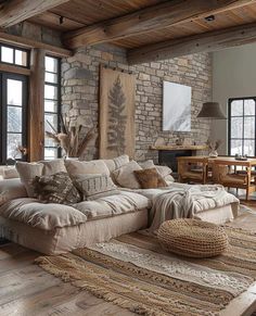 a living room filled with lots of furniture next to a brick wall and wooden floors